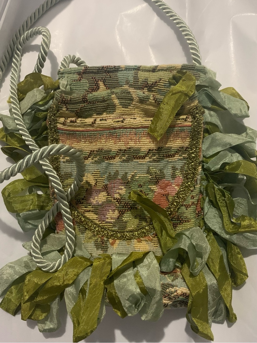 Tapestry floral shoulder bag with ribbon fringe braided rope strap